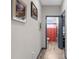 Hallway with wood-look flooring leading to bathroom and bedroom at 1116 406Th E Ct, Myakka City, FL 34251