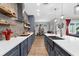 Gourmet kitchen with professional range, custom cabinetry, and open layout at 1116 406Th E Ct, Myakka City, FL 34251