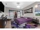 Serene bedroom with modern sliding doors to closet, contemporary decor, and large window at 1116 406Th E Ct, Myakka City, FL 34251