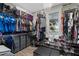 Organized walk-in closet with ample shelving, hanging space, and natural light at 1116 406Th E Ct, Myakka City, FL 34251