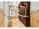 Opulent bathroom featuring travertine walls, soaking tub and a spacious shower with glass enclosure at 11504 Splendid Ln, Tampa, FL 33626