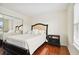 Inviting bedroom with a stylish bed, mirrored closet doors, and a bright window at 11504 Splendid Ln, Tampa, FL 33626