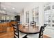 Sun-filled dining area featuring a wooden table and chairs adjacent to a kitchen with granite countertops at 11504 Splendid Ln, Tampa, FL 33626