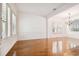 Bright dining area with wood floors, plantation shutters, and decorative molding at 11504 Splendid Ln, Tampa, FL 33626