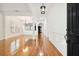 Bright and open foyer with gleaming hardwood floors and elegant lighting fixtures at 11504 Splendid Ln, Tampa, FL 33626