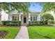 Inviting home with a manicured lawn and brick walkway, offering a warm and welcoming atmosphere at 11504 Splendid Ln, Tampa, FL 33626