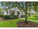 A beautiful home showcasing manicured front yard with lush greenery, offering a picturesque curb appeal at 11504 Splendid Ln, Tampa, FL 33626