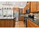 This kitchen features stainless steel appliances, granite countertops and an island with pendant lighting at 11504 Splendid Ln, Tampa, FL 33626