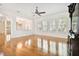 Open living room with hardwood floors, neutral walls, recessed lighting, and abundant natural light at 11504 Splendid Ln, Tampa, FL 33626