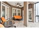 Inviting covered patio with neutral tile flooring, ceiling fan, and comfortable seating, perfect for relaxing outdoors and entertaining at 11504 Splendid Ln, Tampa, FL 33626