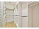 Large walk-in closet with built-in shelving and storage, ready for organization at 11504 Splendid Ln, Tampa, FL 33626