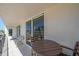 Balcony furnished with seating area, showcases tile floors, view of street and adjacent buildings at 1212 Benjamin Franklin Dr # 306, Sarasota, FL 34236