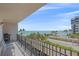Balcony with seating, offering views of the beach, ocean, and coastline at 1212 Benjamin Franklin Dr # 306, Sarasota, FL 34236