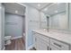 Bathroom with white vanity, granite countertop, and mosaic backsplash at 1212 Benjamin Franklin Dr # 306, Sarasota, FL 34236