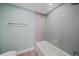 Full bath featuring tile surround and glass partition at 1212 Benjamin Franklin Dr # 306, Sarasota, FL 34236