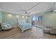 Light-filled bedroom with seating and balcony access, offering a relaxing retreat at 1212 Benjamin Franklin Dr # 306, Sarasota, FL 34236