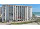 High-rise condo building with multiple balconies, near ocean views and convenient parking at 1212 Benjamin Franklin Dr # 306, Sarasota, FL 34236