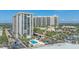 Exterior showcasing condo building with pool, landscaping, and proximity to beaches at 1212 Benjamin Franklin Dr # 306, Sarasota, FL 34236