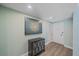Entryway featuring light walls, modern wall art, and a modern cabinet at 1212 Benjamin Franklin Dr # 306, Sarasota, FL 34236