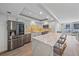 Bright kitchen with stainless steel appliances, island seating and modern design at 1212 Benjamin Franklin Dr # 306, Sarasota, FL 34236