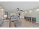 Open-concept living space with modern furnishings, light walls, and a view into the kitchen at 1212 Benjamin Franklin Dr # 306, Sarasota, FL 34236
