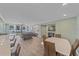 Open-concept living space with a view to the balcony, modern decor, and lots of light at 1212 Benjamin Franklin Dr # 306, Sarasota, FL 34236