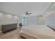This main bedroom features a ceiling fan, recessed lighting, and luxury vinyl plank flooring at 1212 Benjamin Franklin Dr # 306, Sarasota, FL 34236