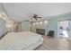 This main bedroom has access to a balcony, recessed lighting, and vinyl plank flooring at 1212 Benjamin Franklin Dr # 306, Sarasota, FL 34236