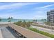 Scenic view of beach and ocean from the property's parking area at 1212 Benjamin Franklin Dr # 306, Sarasota, FL 34236