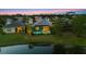 Aerial view showcasing a beautiful home with a pool and screened patio, nestled next to a serene pond at 12237 Longview Lake Cir, Bradenton, FL 34211