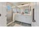 Bright bathroom with double vanity, walk-in shower and updated fixtures at 12237 Longview Lake Cir, Bradenton, FL 34211