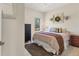 Cozy bedroom with a ceiling fan, bed, and a view of the outdoors at 12237 Longview Lake Cir, Bradenton, FL 34211