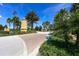 Inviting Lakewood Ranch entrance with lush landscaping and stately gate pillars at 12237 Longview Lake Cir, Bradenton, FL 34211