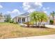Charming home with a landscaped front yard and covered porch, offering curb appeal and charm at 12237 Longview Lake Cir, Bradenton, FL 34211