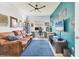 Comfortable home office features a sofa and wall mounted tv at 12237 Longview Lake Cir, Bradenton, FL 34211