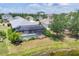 Screened-in pool and spa with lush landscaping offering a private backyard retreat at 12237 Longview Lake Cir, Bradenton, FL 34211