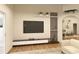 Modern living room with stylish media center and open archway to other living spaces at 12535 Estrella Blvd, Punta Gorda, FL 33955
