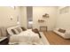 Bright bedroom features hardwood floors, a comfortable bed, a sofa and contemporary decor at 12535 Estrella Blvd, Punta Gorda, FL 33955