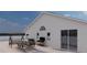 Home featuring an outdoor eating area with nice views and a grill at 12541 Estrella Blvd, Punta Gorda, FL 33955