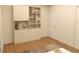 Beige cabinet with drawers and shelves, perfect for storage and displaying decorations at 12541 Estrella Blvd, Punta Gorda, FL 33955