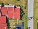 A bird's eye view of townhomes featuring a red tile roof, surrounded by lush landscaping at 1302 58Th W St, Bradenton, FL 34209