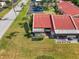 Attractive townhome with a terracotta roof, complemented by a lush lawn and landscaping at 1302 58Th W St, Bradenton, FL 34209