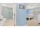 Light-blue bathroom with a walk-in shower and tile floor at 1302 58Th W St, Bradenton, FL 34209