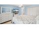 Bright bedroom featuring matching dresser, TV, and closet, offering ample storage and entertainment space at 1302 58Th W St, Bradenton, FL 34209