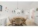 Bright dining room with seating for four and charming decor at 1302 58Th W St, Bradenton, FL 34209