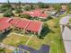 Charming townhomes with vibrant red roofs nestled in a well-maintained, verdant community at 1302 58Th W St, Bradenton, FL 34209