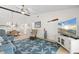 Spacious living room with vaulted ceilings, coastal decor, and open floor plan at 1302 58Th W St, Bradenton, FL 34209