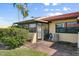 Enclosed sunroom with access to a brick patio at 1302 58Th W St, Bradenton, FL 34209