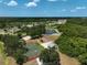 Aerial view of the community amenities with a basketball court, playground, pond, and picnic area at 15608 31St E St, Parrish, FL 34219