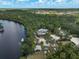 Stunning aerial view of a waterfront property with a private dock and lush surroundings at 15608 31St E St, Parrish, FL 34219